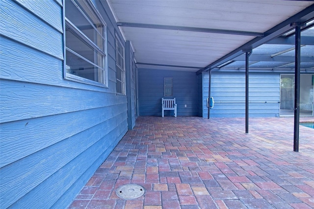 view of patio / terrace with a lanai