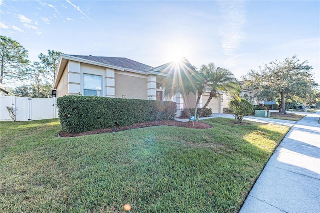 3602 Juneberry Dr, Wesley Chapel, FL 33543 - view of front of property with stucco siding, driveway, and a garage