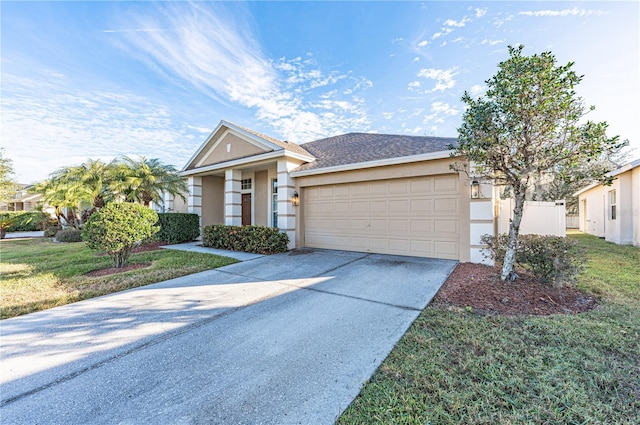 view of front of property featuring a front lawn and a garage