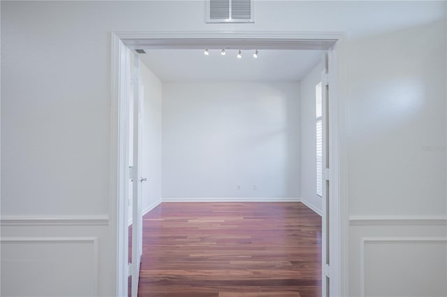3602 Juneberry Dr, Wesley Chapel, FL 33543 - hall with wood finished floors, rail lighting, and baseboards