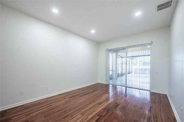 unfurnished room featuring dark hardwood / wood-style floors