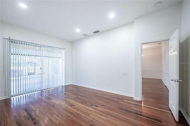 unfurnished room featuring dark hardwood / wood-style flooring