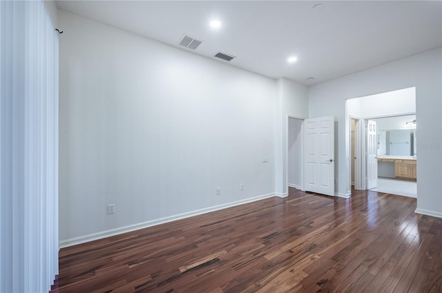 unfurnished room featuring dark wood-type flooring