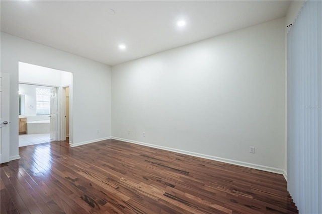 3602 Juneberry Dr, Wesley Chapel, FL 33543 - spare room featuring dark wood-style flooring, baseboards, and recessed lighting