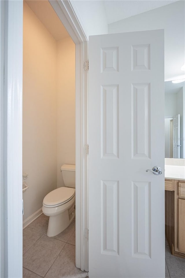 bathroom featuring tile patterned floors and toilet