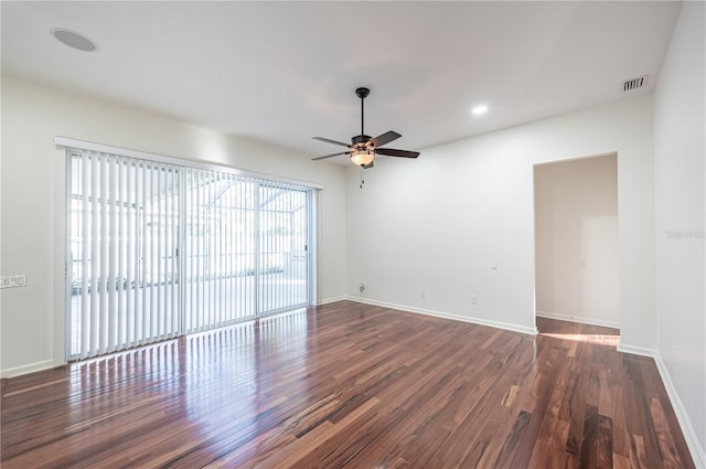 empty room featuring ceiling fan and dark hardwood / wood-style floors