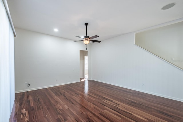 unfurnished room featuring ceiling fan and dark hardwood / wood-style flooring