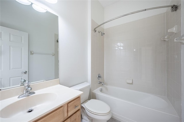 full bathroom with vanity, toilet, and tiled shower / bath