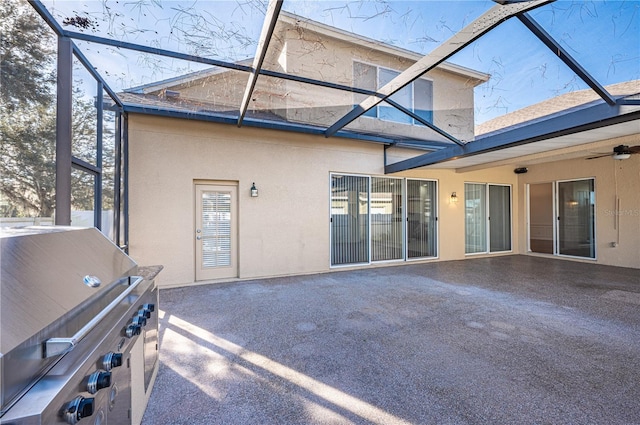 back of house featuring a patio, ceiling fan, and a lanai