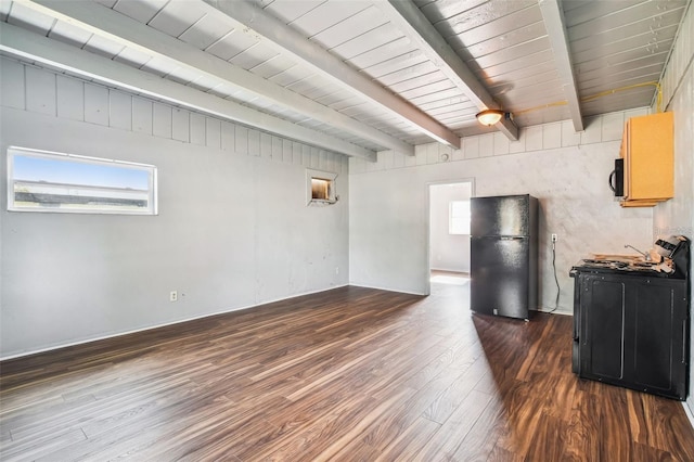 interior space featuring beamed ceiling, wooden ceiling, and dark wood-type flooring