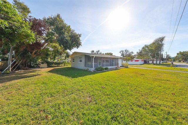 view of yard with a sunroom