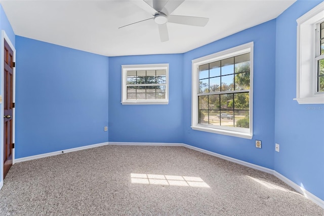 carpeted empty room with ceiling fan