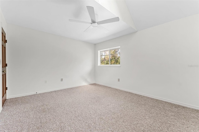 spare room with ceiling fan and carpet floors