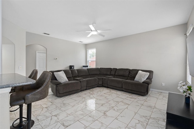 living room featuring ceiling fan