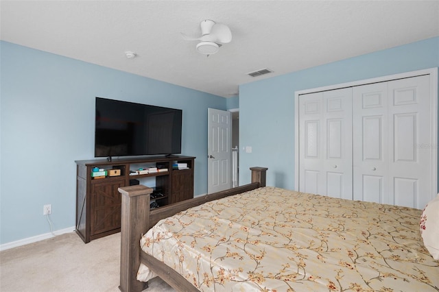 carpeted bedroom with a closet