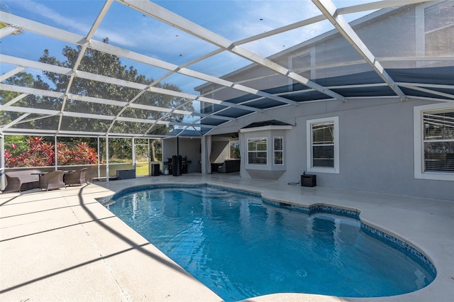 view of pool featuring a lanai and a patio area