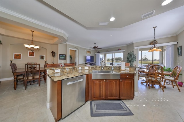 kitchen with dishwasher, an island with sink, pendant lighting, and sink