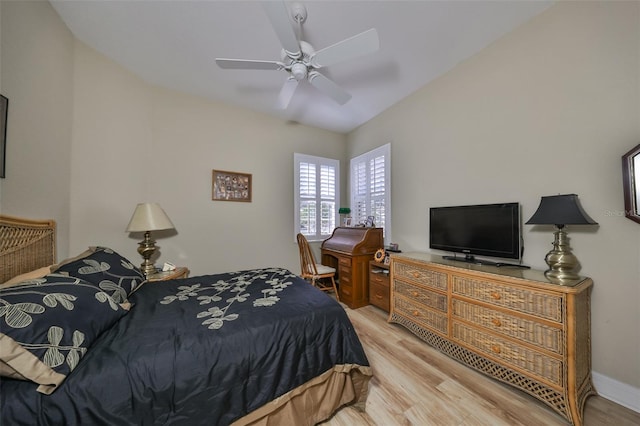 bedroom with ceiling fan and light wood-type flooring