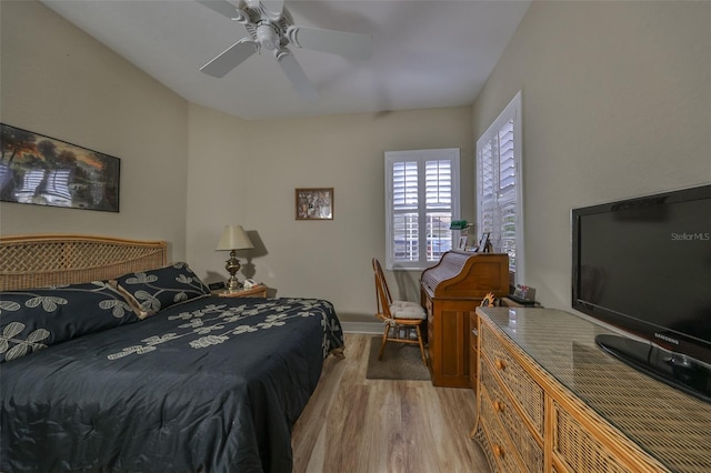 bedroom featuring light hardwood / wood-style flooring and ceiling fan