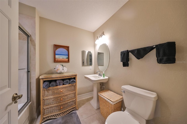 full bathroom with tile patterned floors, sink, enclosed tub / shower combo, toilet, and lofted ceiling