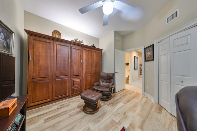 sitting room with light wood-type flooring and ceiling fan