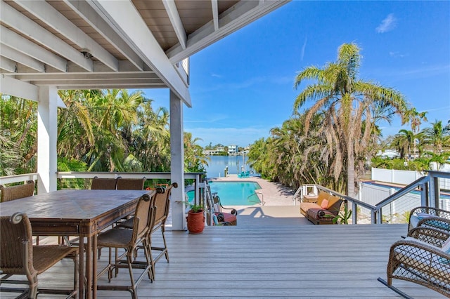 wooden terrace featuring a water view