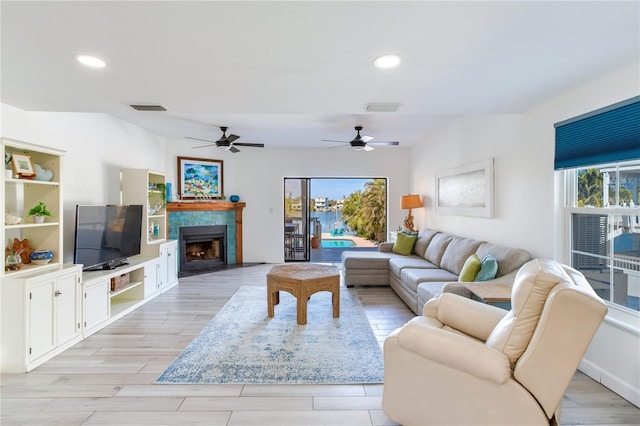 living room featuring light hardwood / wood-style floors and a healthy amount of sunlight