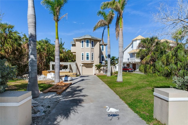 view of front facade featuring a front lawn and a garage