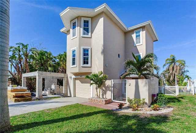 view of front of house featuring a front yard and a garage