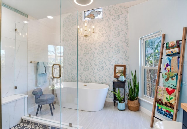 bathroom featuring plus walk in shower and a chandelier