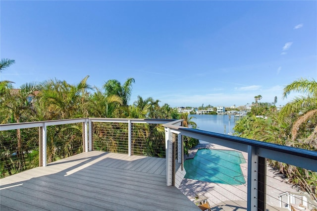 wooden deck featuring a water view