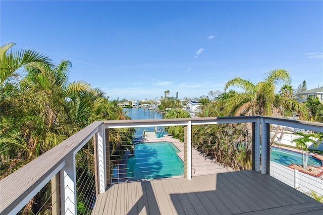 wooden deck with a water view