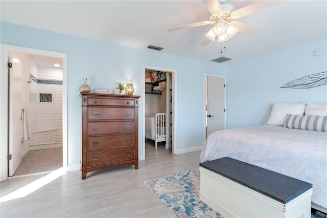 bedroom with connected bathroom, a closet, light hardwood / wood-style flooring, and ceiling fan