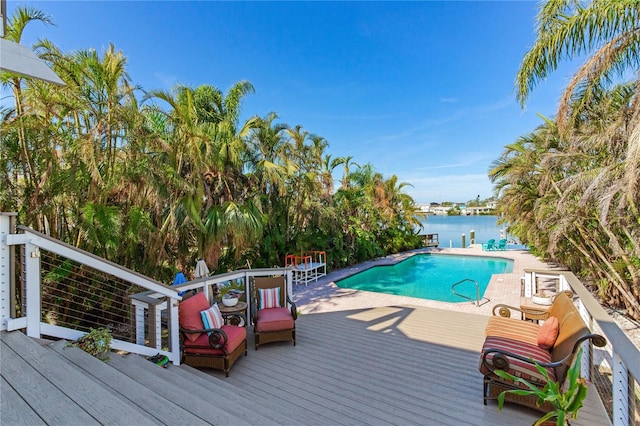 view of swimming pool with a deck with water view