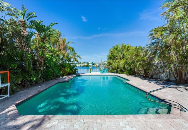 view of swimming pool featuring a water view