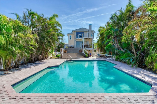 view of swimming pool featuring a patio