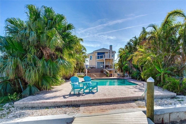 view of swimming pool with a patio area