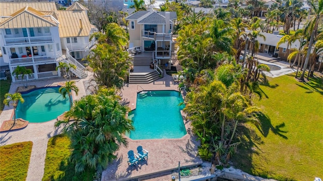 view of swimming pool featuring a patio area