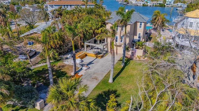 birds eye view of property with a water view