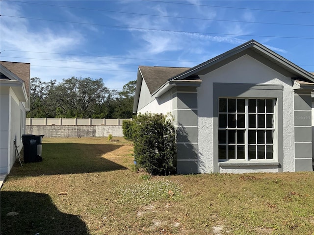 view of property exterior featuring a yard