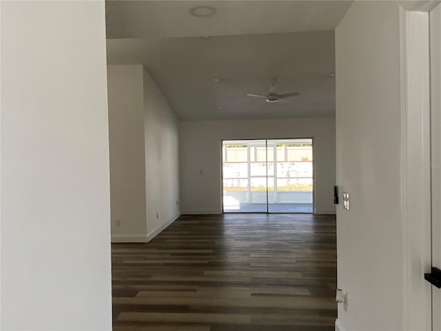 empty room featuring dark hardwood / wood-style flooring and ceiling fan