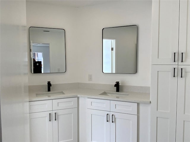 bathroom with vanity and a healthy amount of sunlight