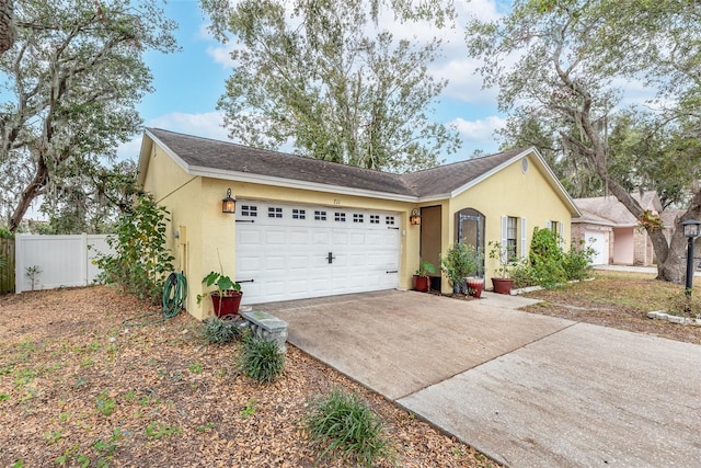 single story home featuring a garage