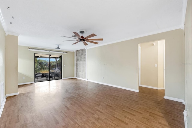 spare room with hardwood / wood-style flooring, ceiling fan, and ornamental molding