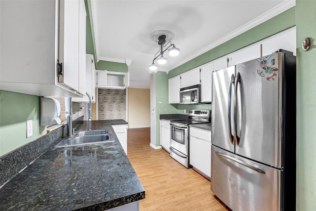 kitchen with white cabinetry, sink, crown molding, appliances with stainless steel finishes, and light wood-type flooring