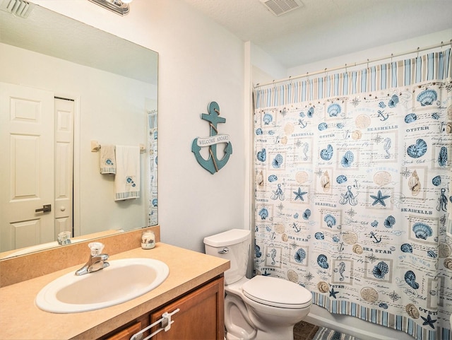 bathroom with a shower with curtain, toilet, and vanity