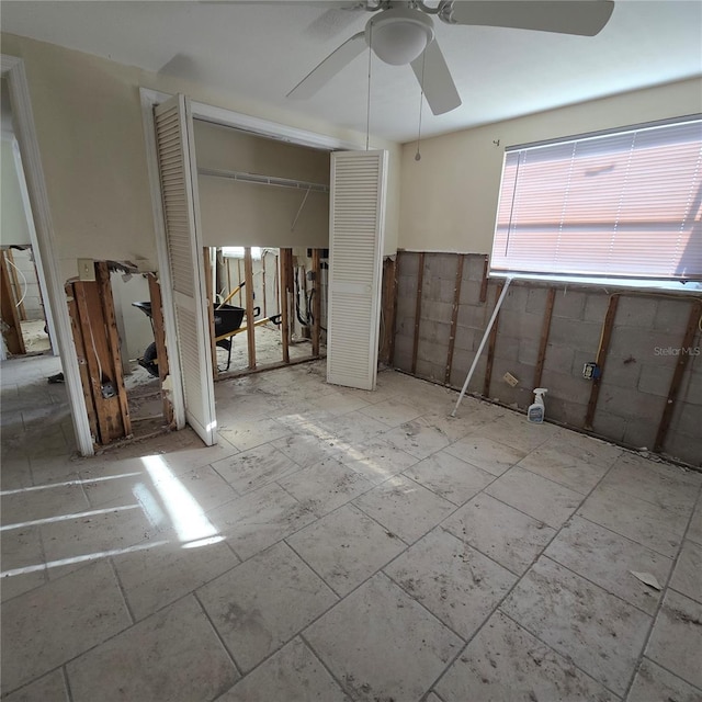 interior space featuring ceiling fan