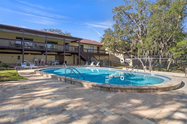 view of swimming pool featuring a patio