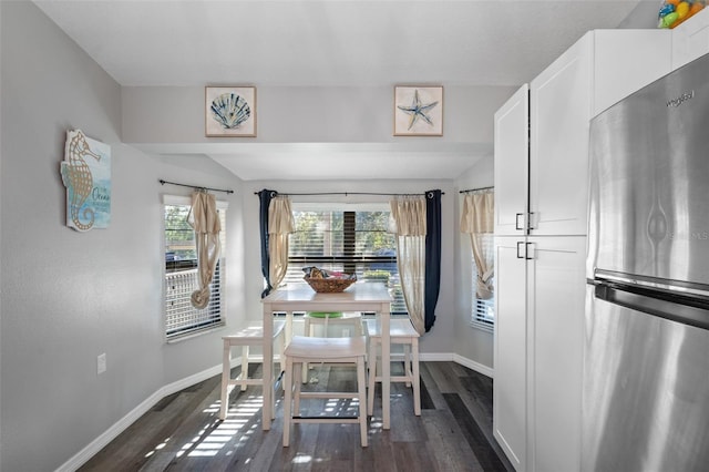 dining area featuring dark hardwood / wood-style flooring