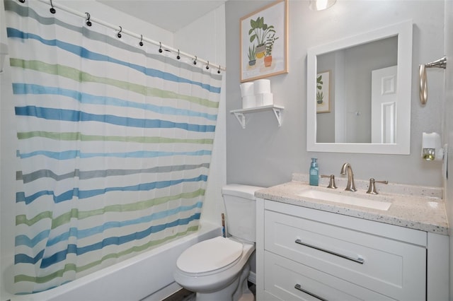 full bathroom with vanity, shower / bath combo, and toilet